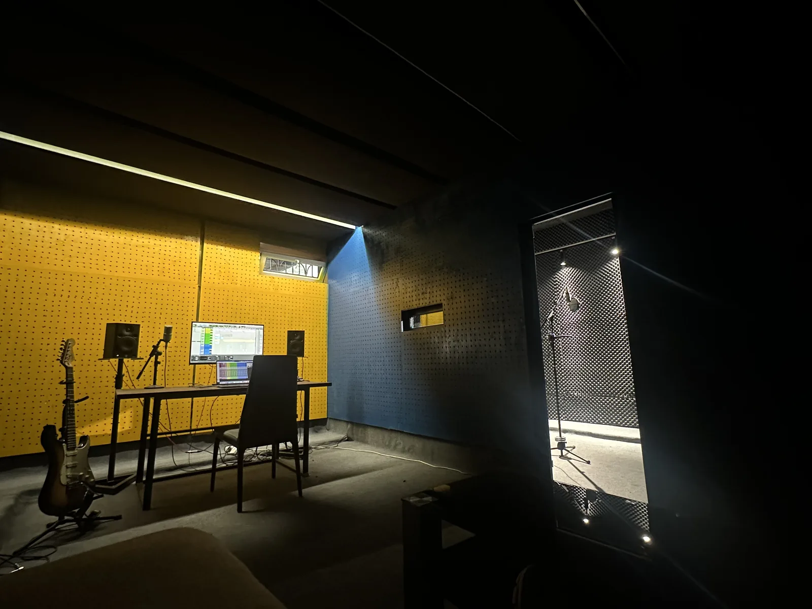 Audio Sardapi control room with the vocal booth behind glass